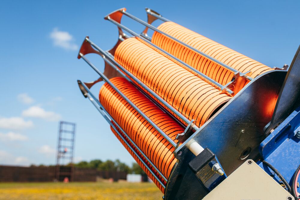 Automatic clay trap stacked with orange Eurotarget clays