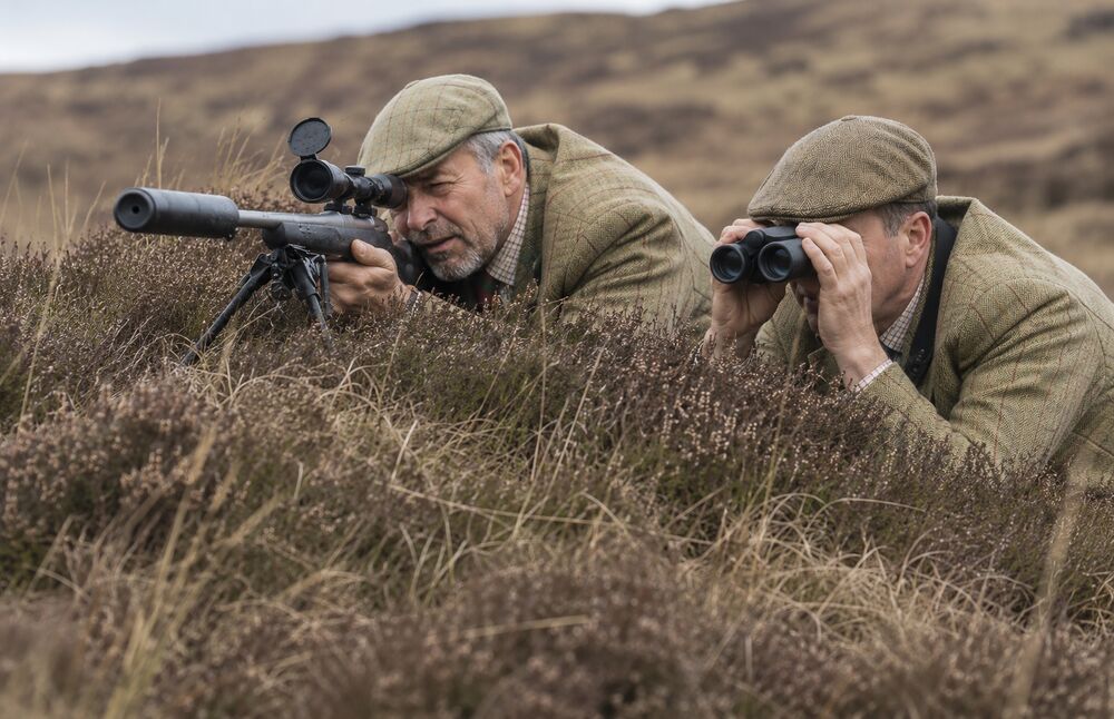 Stalkers with rifle, bipod and binoculars